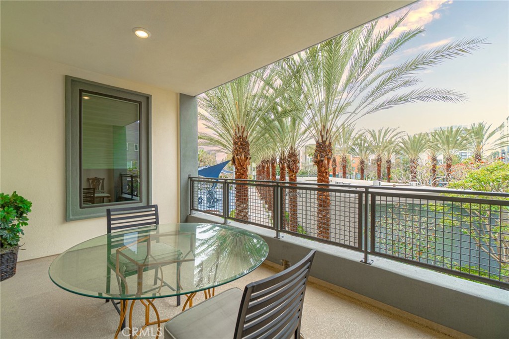 185 Tribeca Irvine, CA 92612 - Photo 19 of 55 a dining room with furniture and a window