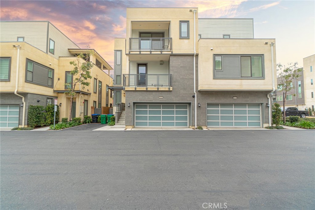 185 Tribeca Irvine, CA 92612 - Photo 2 of 55 front view of a brick house with a street