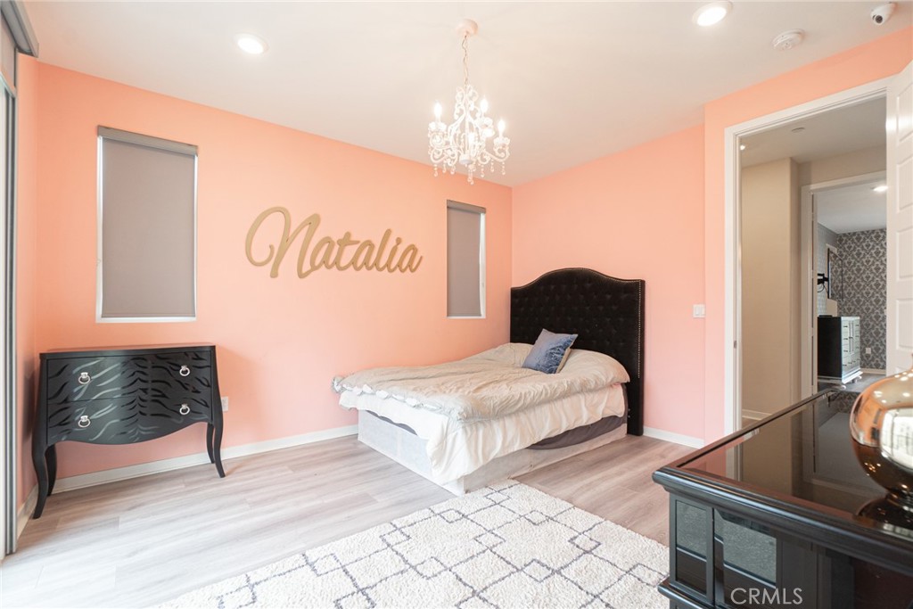 185 Tribeca Irvine, CA 92612 - Photo 22 of 55 a bedroom with a bed and a couch