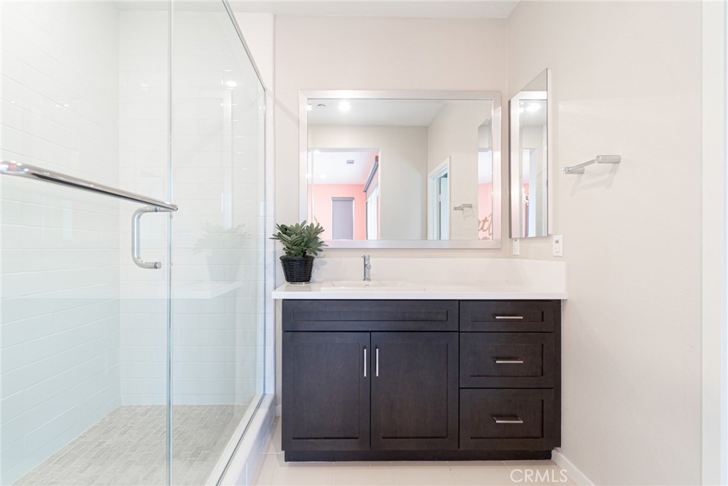 185 Tribeca Irvine, CA 92612 - Photo 23 of 55 a bathroom with a sink and a mirror