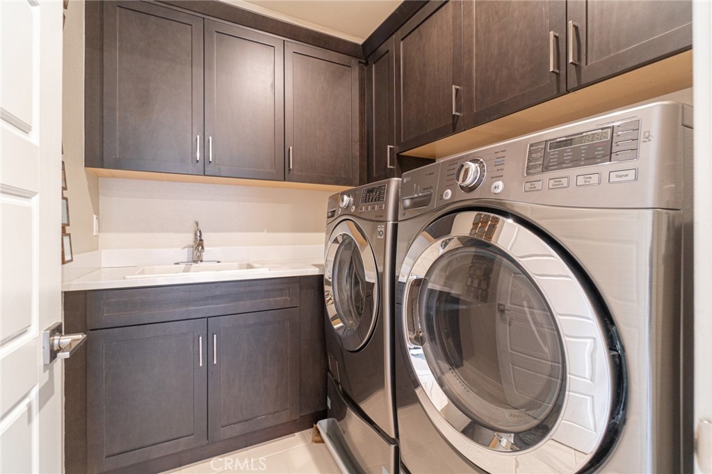 185 Tribeca Irvine, CA 92612 - Photo 26 of 55 a utility room with dryer and washer