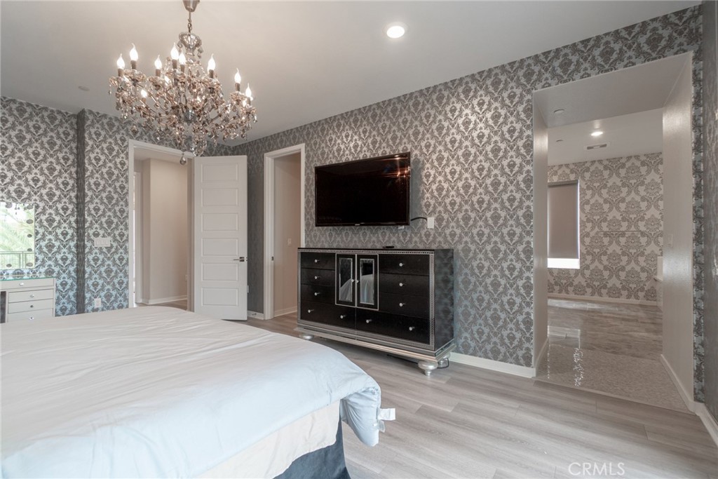 185 Tribeca Irvine, CA 92612 - Photo 29 of 55 a living room with fireplace and a flat screen tv