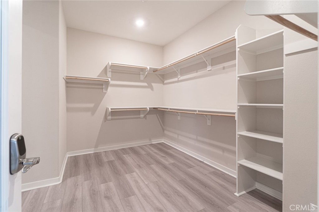 185 Tribeca Irvine, CA 92612 - Photo 32 of 55 a view of walk in closet with empty racks