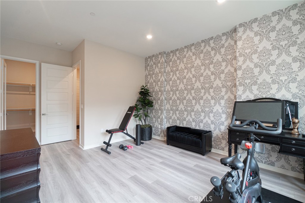 185 Tribeca Irvine, CA 92612 - Photo 36 of 55 a room with furniture and a fireplace