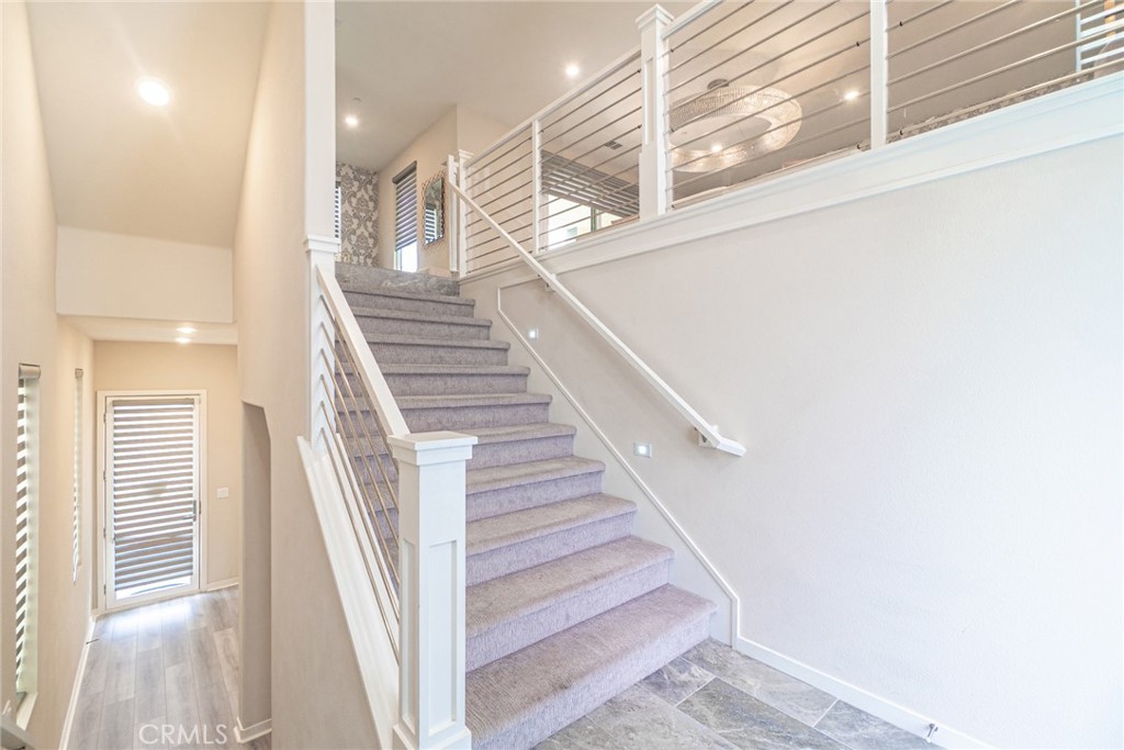 185 Tribeca Irvine, CA 92612 - Photo 4 of 55 a view of entryway and hall with wooden floor