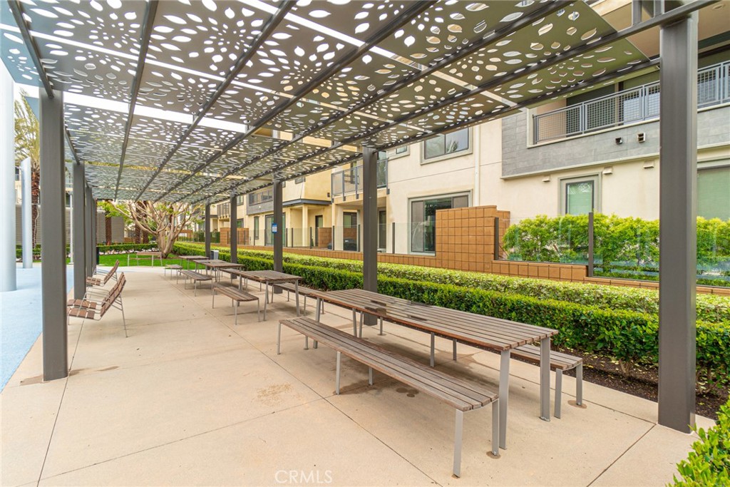 185 Tribeca Irvine, CA 92612 - Photo 47 of 55 a view of swimming pool with outdoor seating and a garden