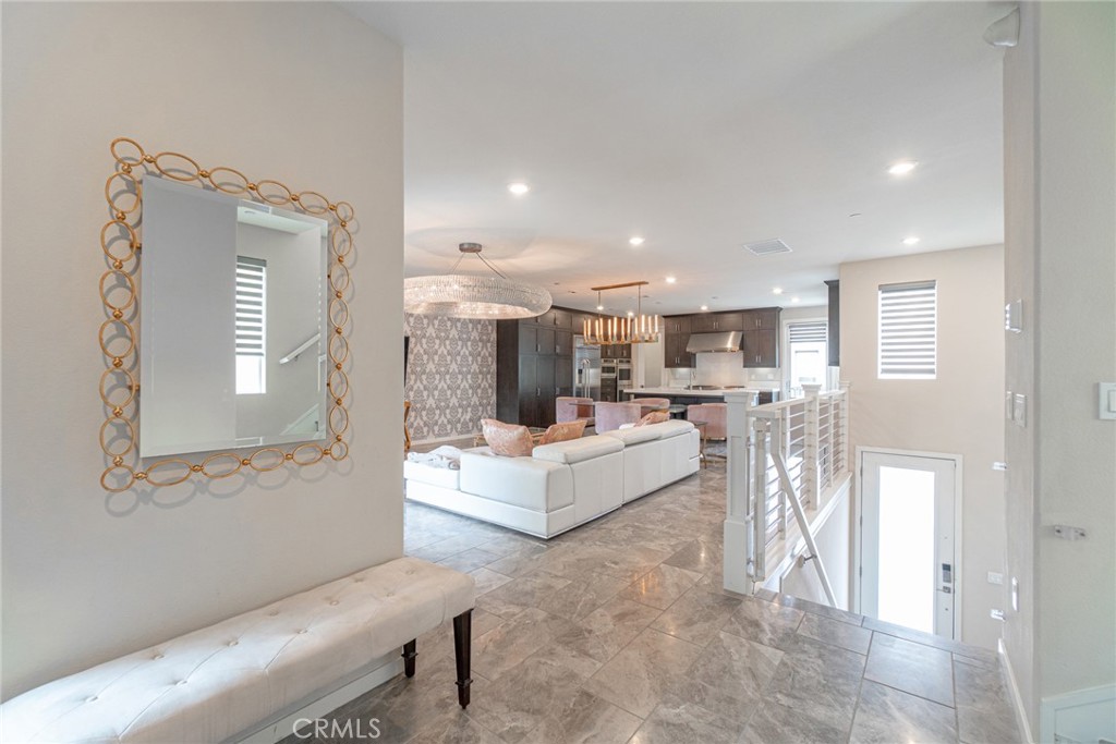 185 Tribeca Irvine, CA 92612 - Photo 5 of 55 a living room with furniture and a large window