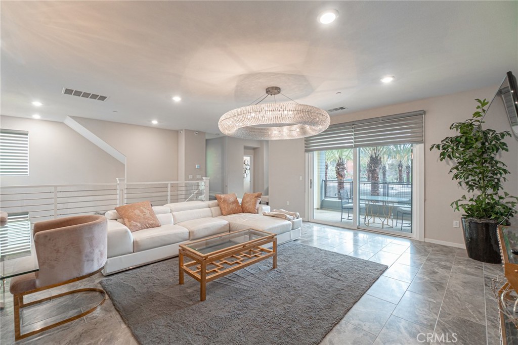 185 Tribeca Irvine, CA 92612 - Photo 9 of 55 a living room with furniture and a potted plant