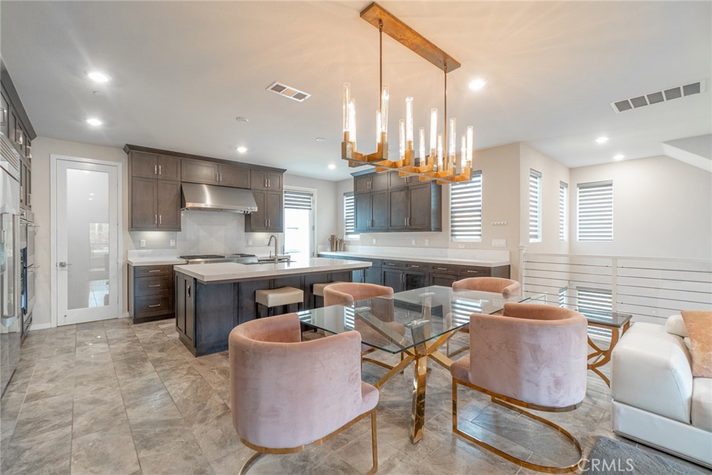 185 Tribeca Irvine, CA 92612 - Photo 10 of 55 a kitchen with a sink cabinets and window