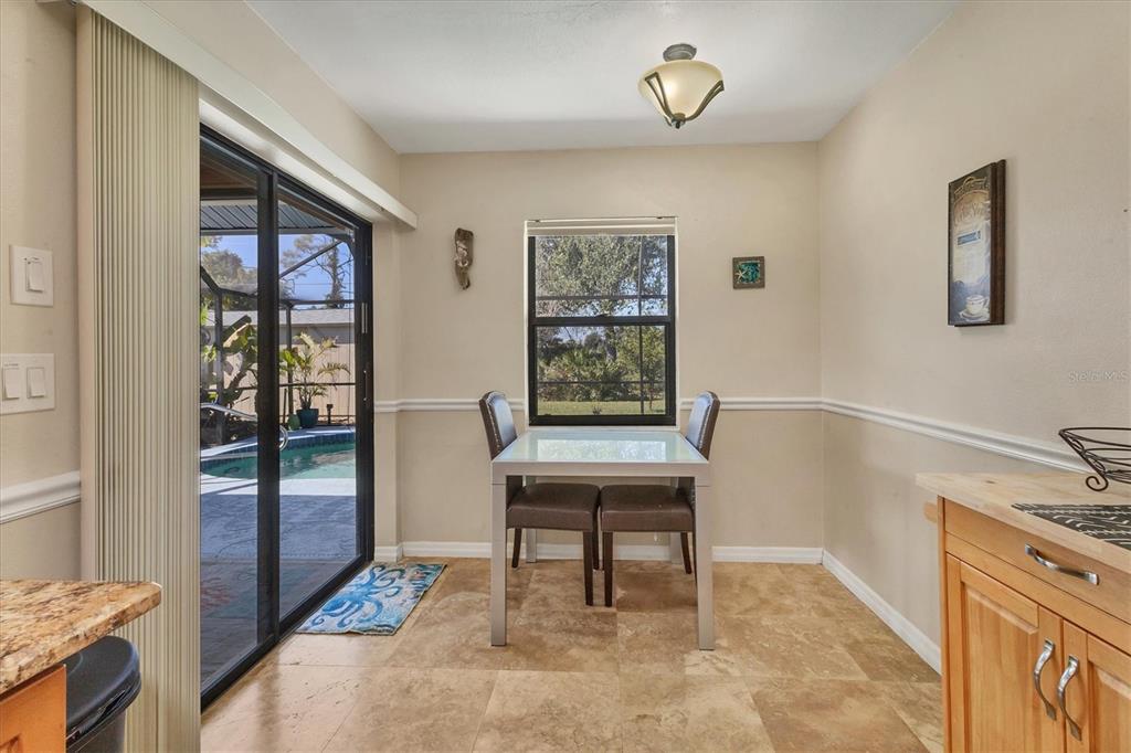 7047 Adderly Road Englewood, FL 34224 - Photo 12 of 39 a view of a livingroom with furniture and window
