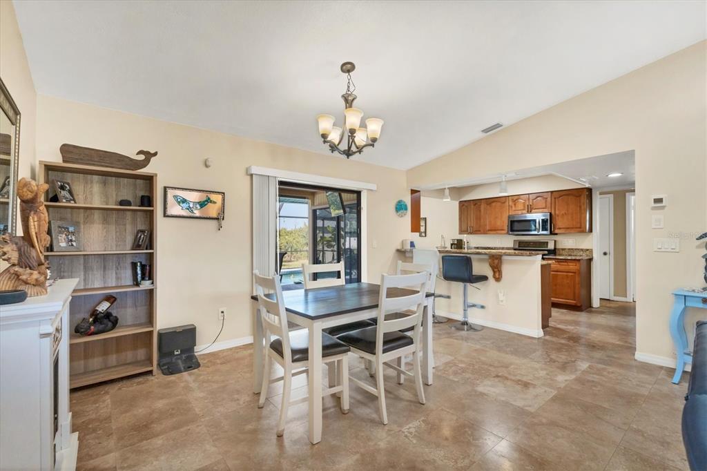 7047 Adderly Road Englewood, FL 34224 - Photo 15 of 39 a view of a dining room kitchen and a window
