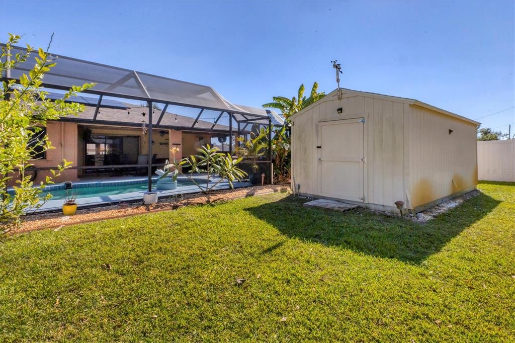 7047 Adderly Road Englewood, FL 34224 - Photo 30 of 39 a view of a backyard