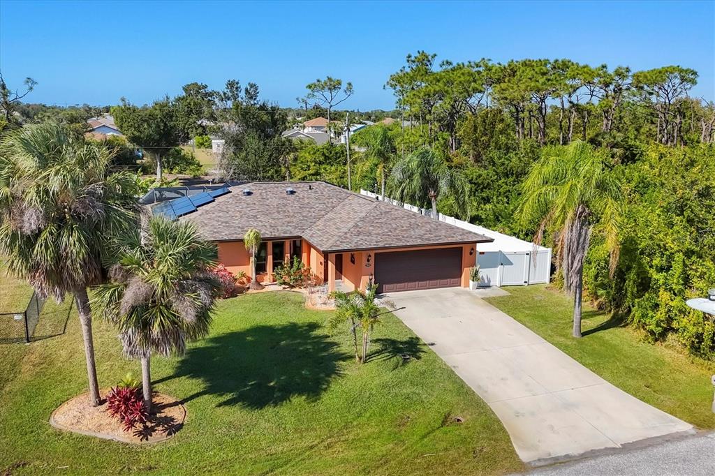 7047 Adderly Road Englewood, FL 34224 - Photo 34 of 39 a view of a house with a yard