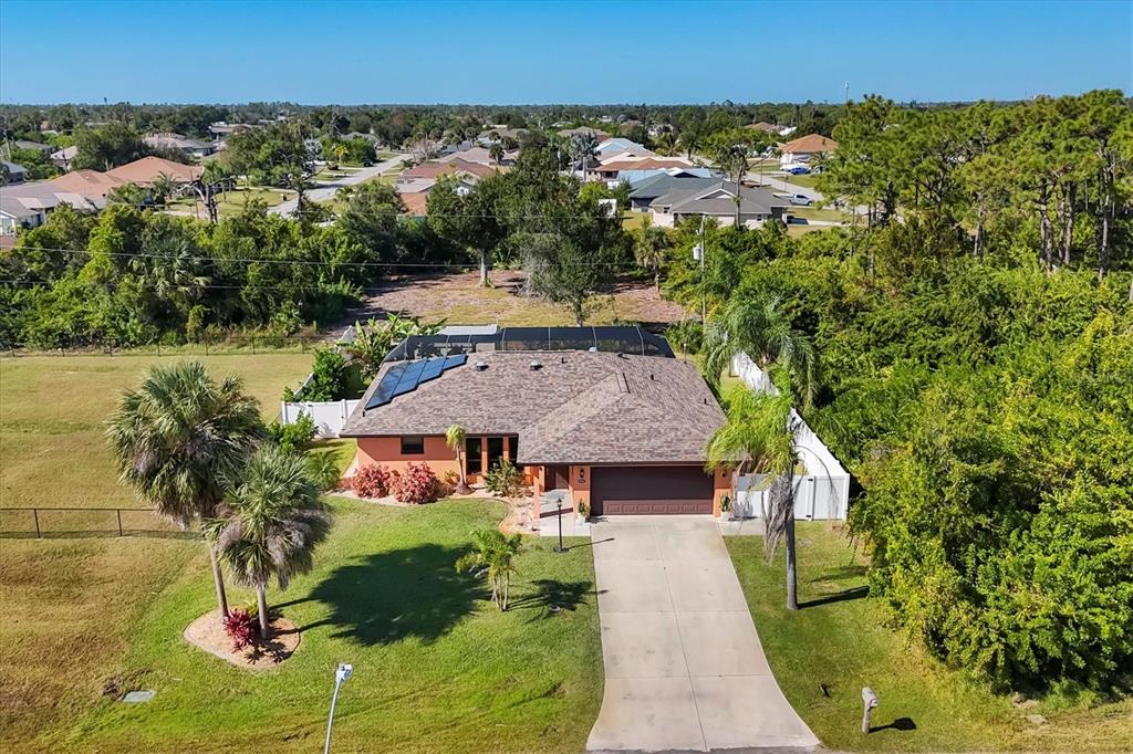7047 Adderly Road Englewood, FL 34224 - Photo 35 of 39 an aerial view of a house with a yard
