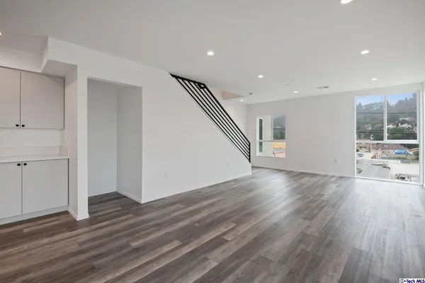 a view of an entryway with wooden floor