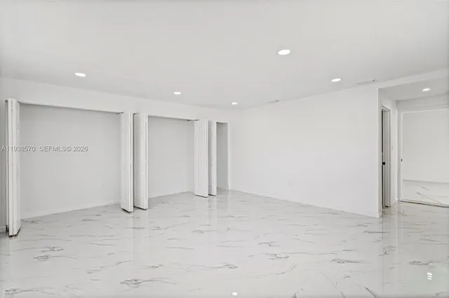 an empty room with windows