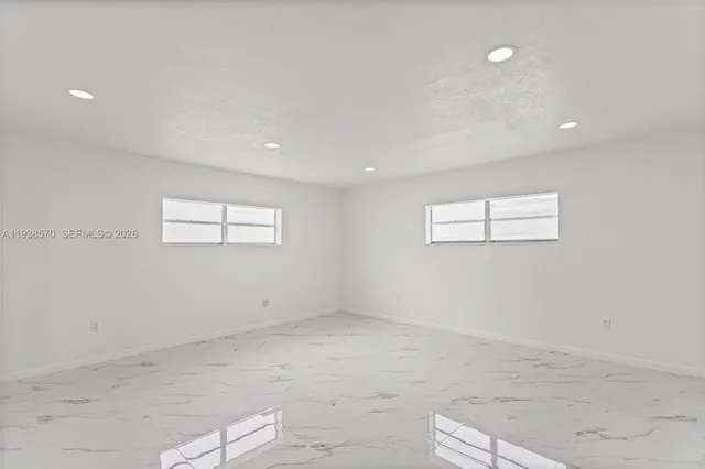 a bathroom with a bathtub and a toilet