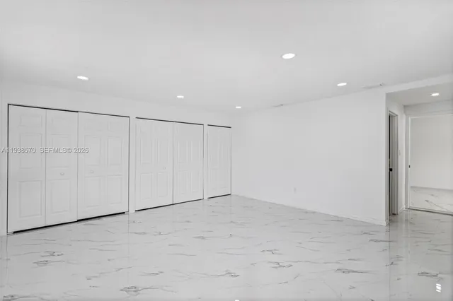 a bathroom with a sink a bathtub and a mirror