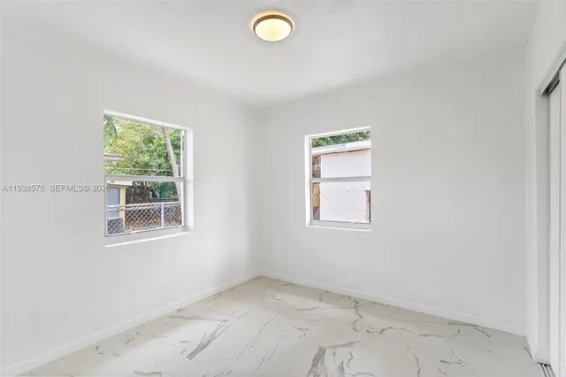 an empty room with windows