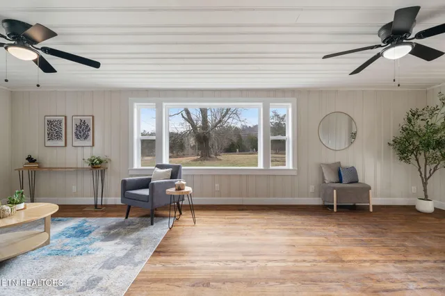 a dining room with furniture and wooden floor