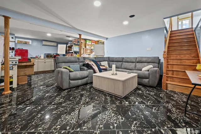 a living room with furniture and a couch