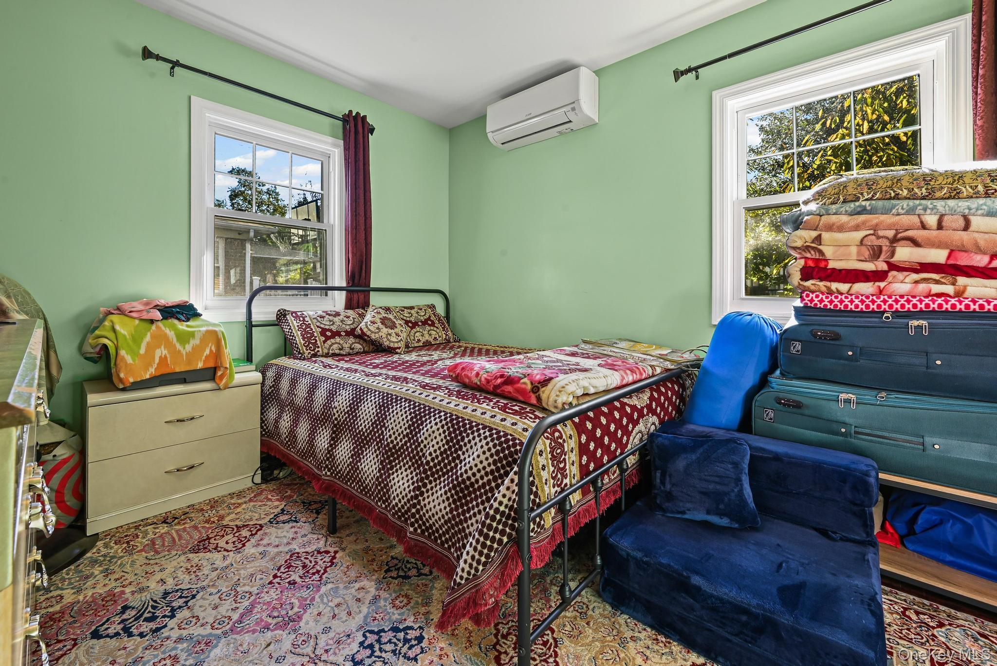 49 Ashley Drive Valley Stream, NY 11580 - Photo 19 of 29 a bedroom with a bed and a window