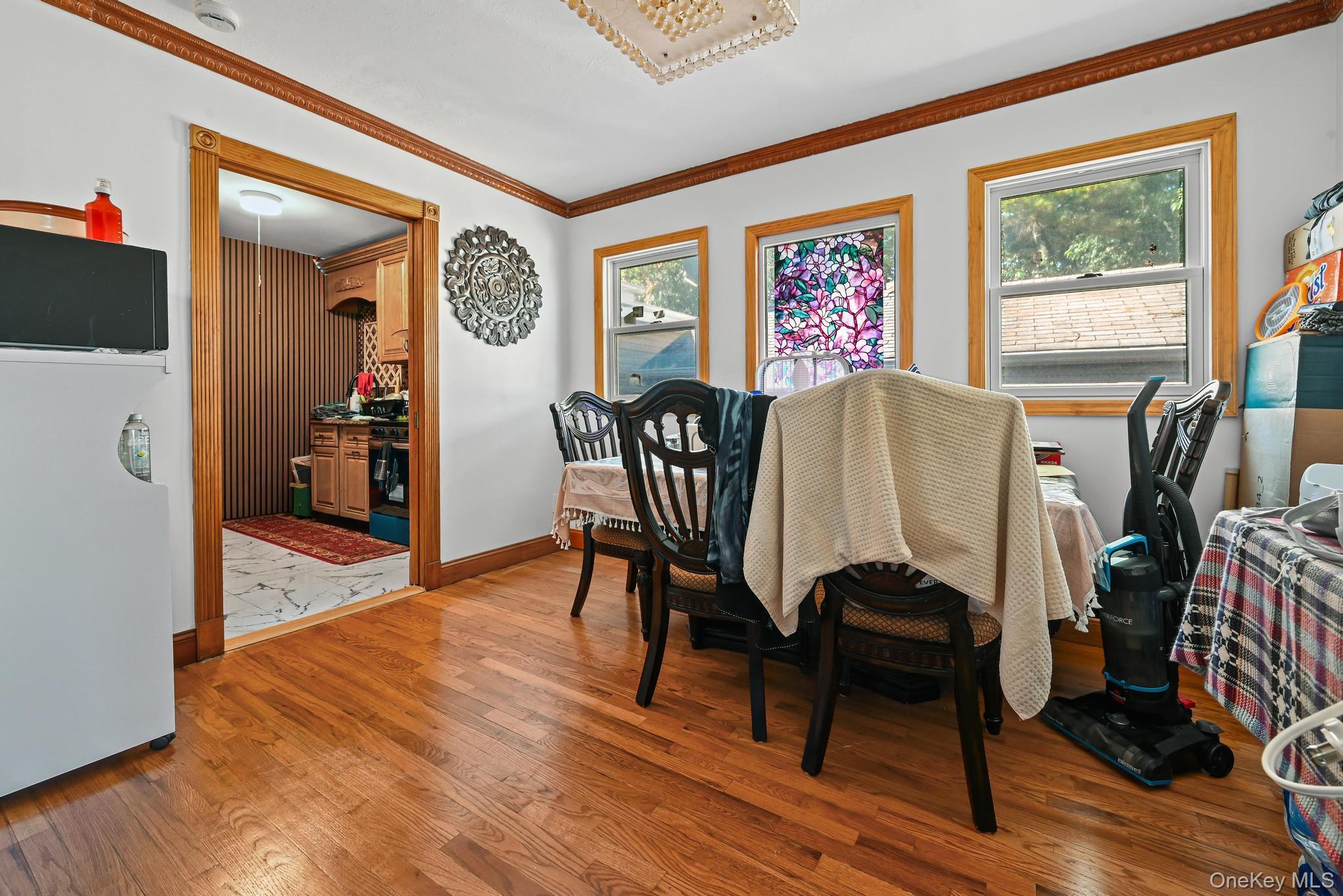 49 Ashley Drive Valley Stream, NY 11580 - Photo 21 of 29 a view of a dining room with furniture window and wooden floor
