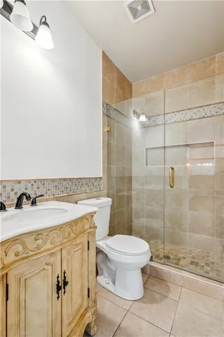 a view of empty room with wooden floor and window