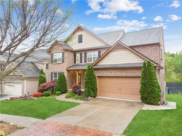 front view of a house with a yard