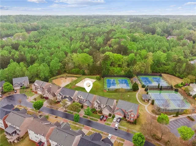 an aerial view of residential houses with outdoor space