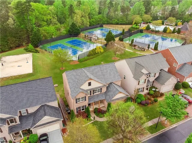 an aerial view of a house with outdoor space
