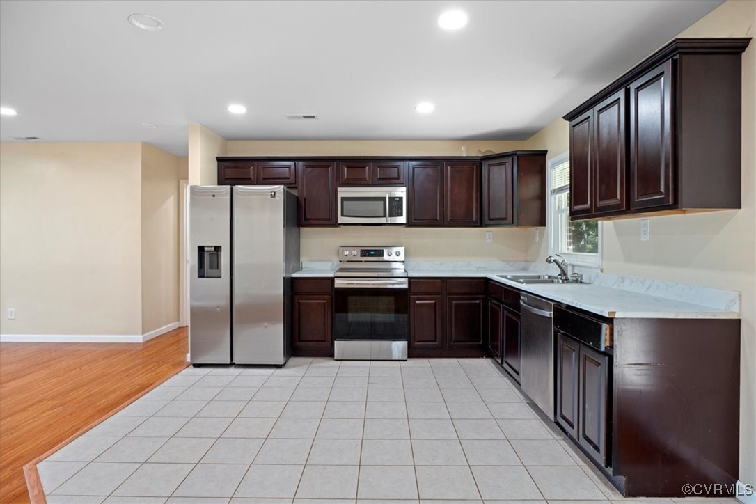 9217 South Quay Road Suffolk, VA 23437 - Photo 29 of 46 a kitchen with stainless steel appliances granite countertop a refrigerator and a sink