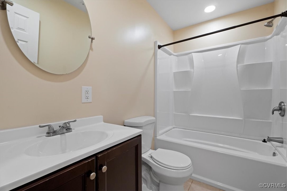 9217 South Quay Road Suffolk, VA 23437 - Photo 35 of 46 a bathroom with a sink a toilet and a mirror
