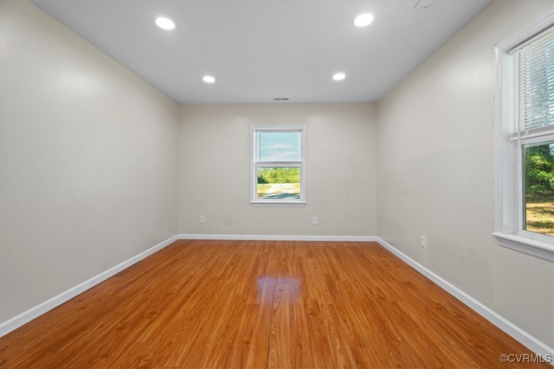 9217 South Quay Road Suffolk, VA 23437 - Photo 42 of 46 a view of an empty room with wooden floor and a window
