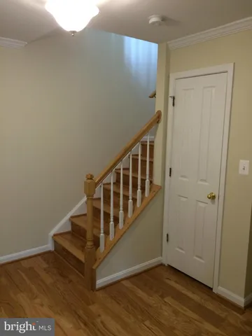 a view of entryway with wooden floor
