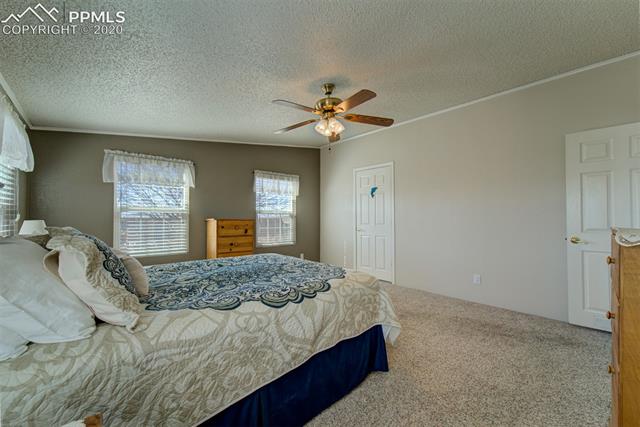 8050 Edison Road Yoder, CO 80864 - Photo 21 of 34 Door on left is into the master bath