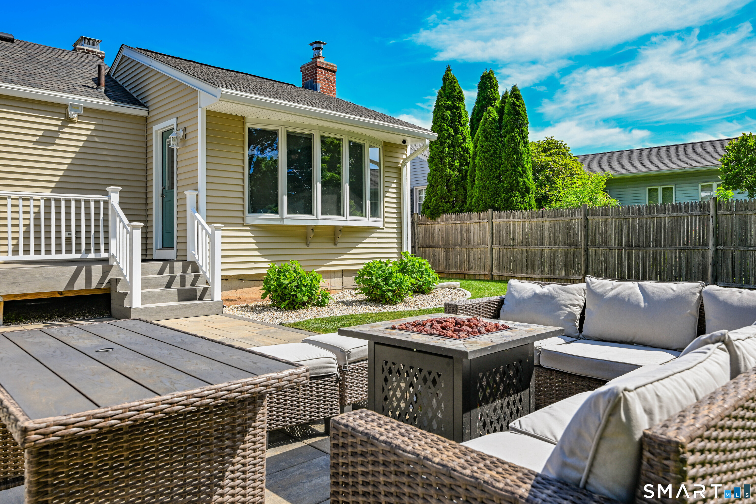 87 Lydall Road Newington, CT 06111 - Photo 26 of 35 a view of a patio with couches table and chairs and potted plants
