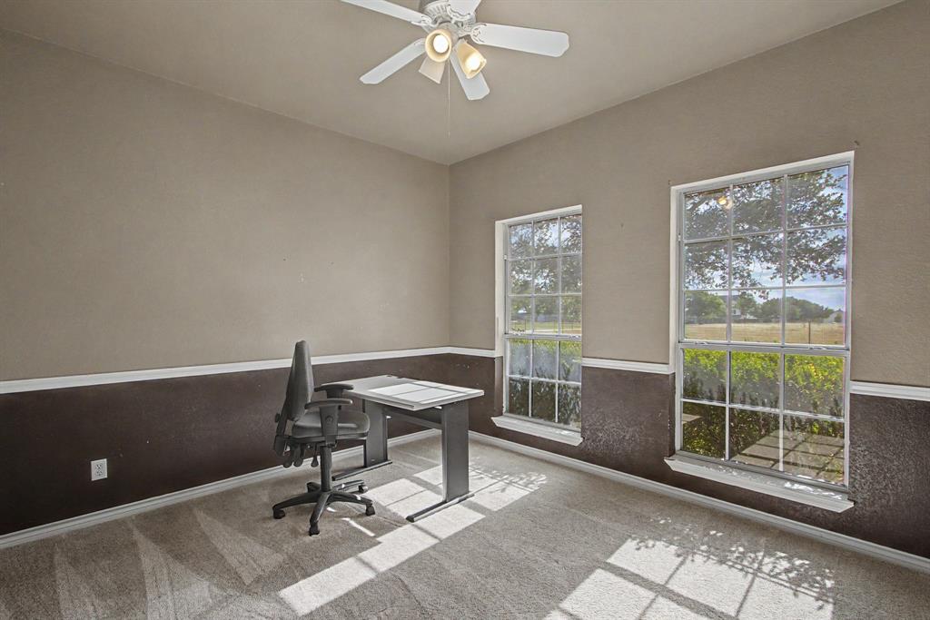 483 Christy Kay Lane Rhome, TX 76078 - Photo 6 of 40 a view of a workspace with furniture and a window