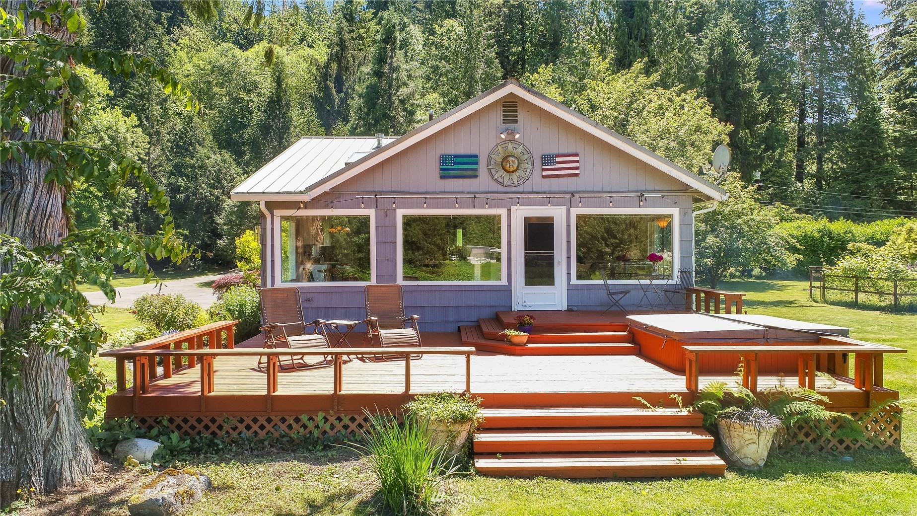35420 Southeast David Powell Road Fall City, WA 98024 - Photo 3 of 25 a front view of a house with a yard table and chairs