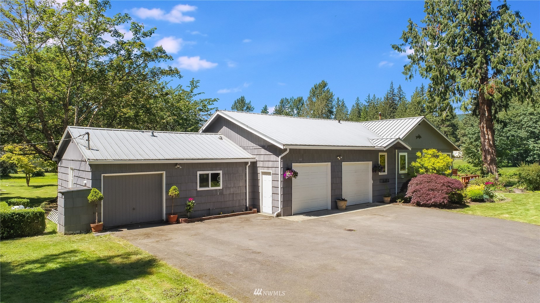 35420 Southeast David Powell Road Fall City, WA 98024 - Photo 8 of 25 a front view of a house with a yard and garage