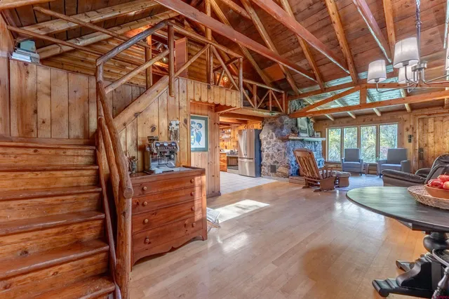 a view of a room with lots of wooden furniture and racks
