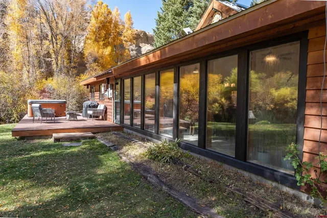 a front view of a house with a yard balcony