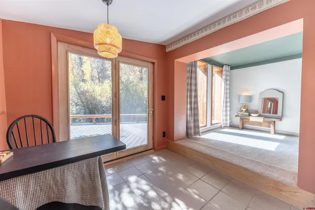 a view of a bedroom with furniture window and front door
