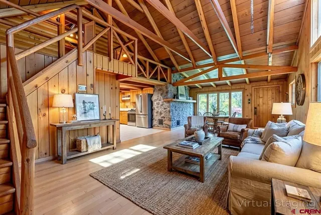 a outdoor living space with patio furniture and a fireplace