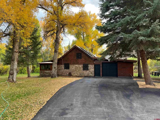 a house with trees in front of it