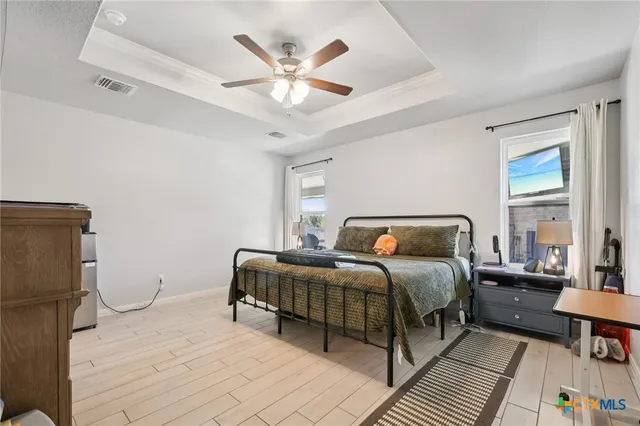 a bedroom with a bed and a cabinets