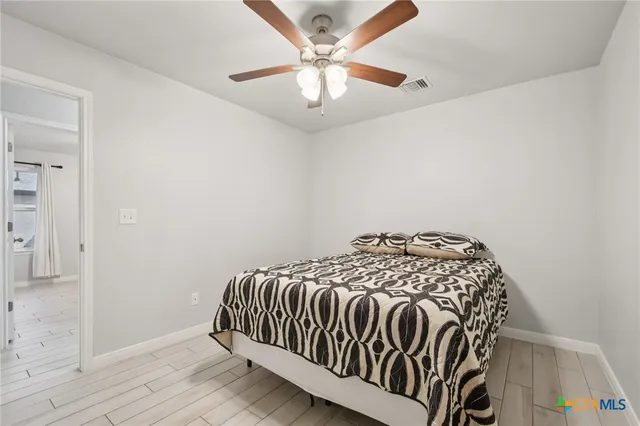 a dining room with furniture and a floor to ceiling window