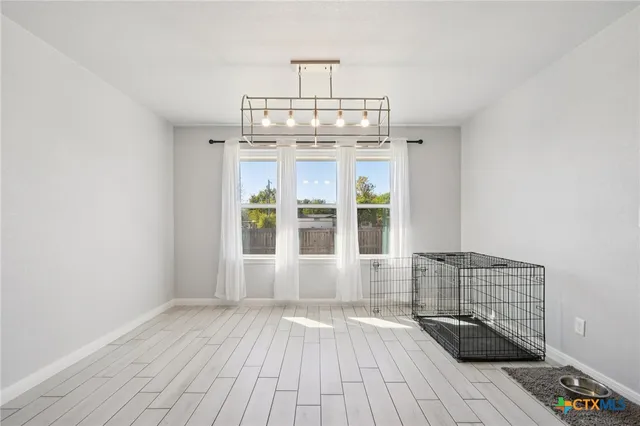 a kitchen with sink stove and cabinets