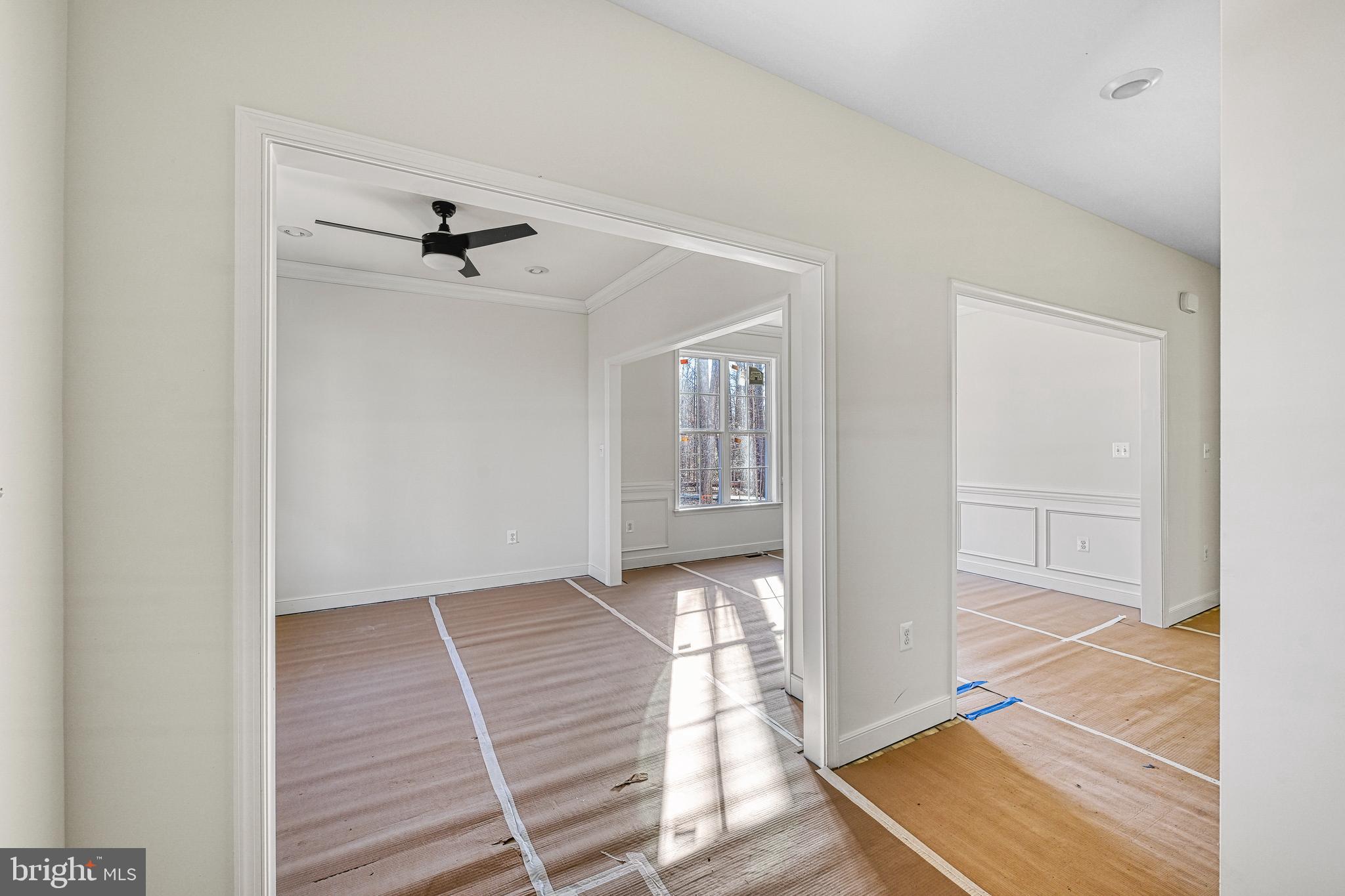 172 Covenant Way Bumpass, VA 23024 - Photo 11 of 56 a view of a hallway with wooden floor and a living room