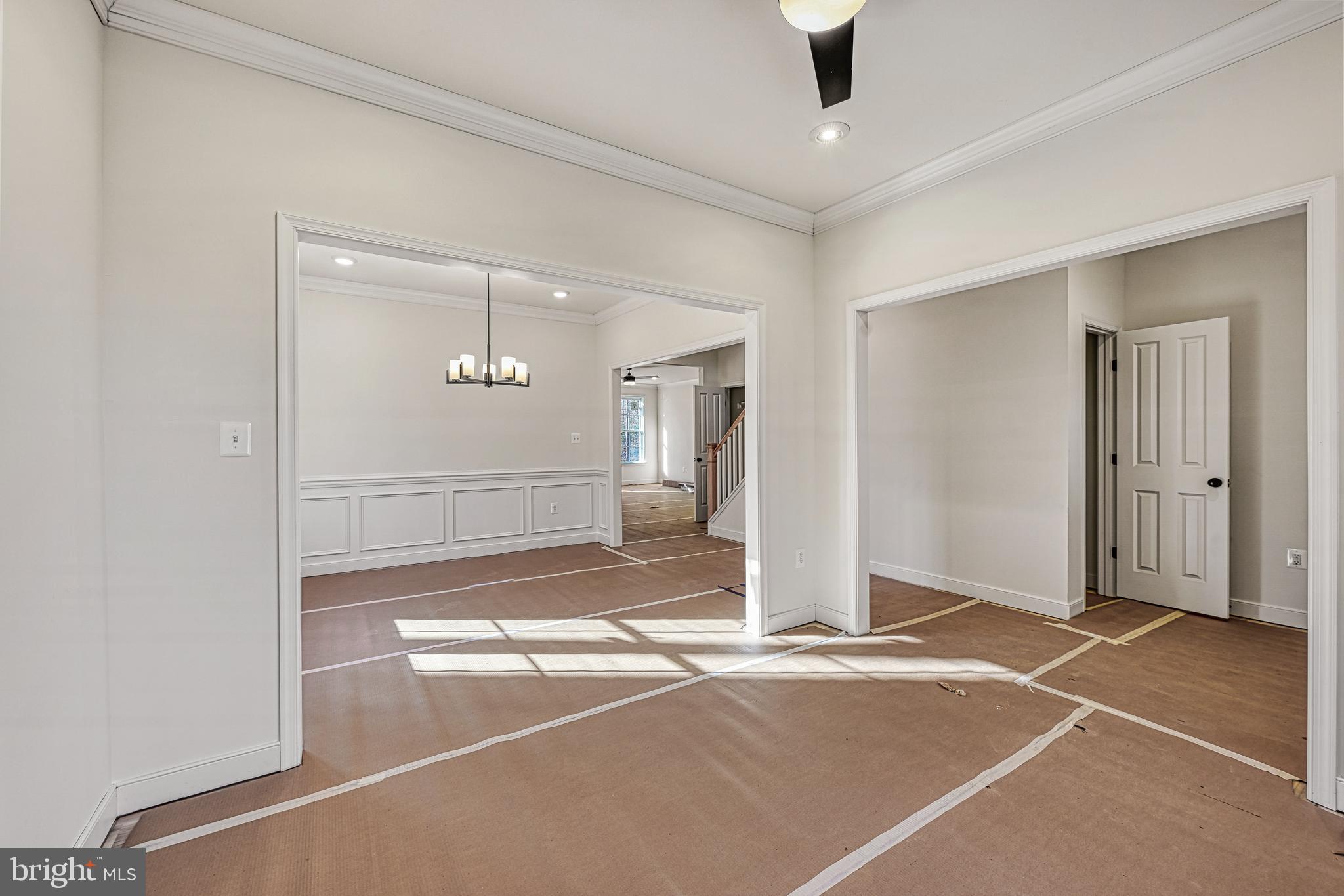 172 Covenant Way Bumpass, VA 23024 - Photo 14 of 56 a view of a livingroom with wooden floor and a ceiling fan